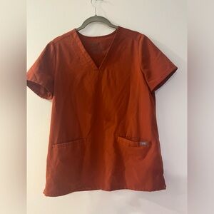 Figs burnt orange top. Size S.